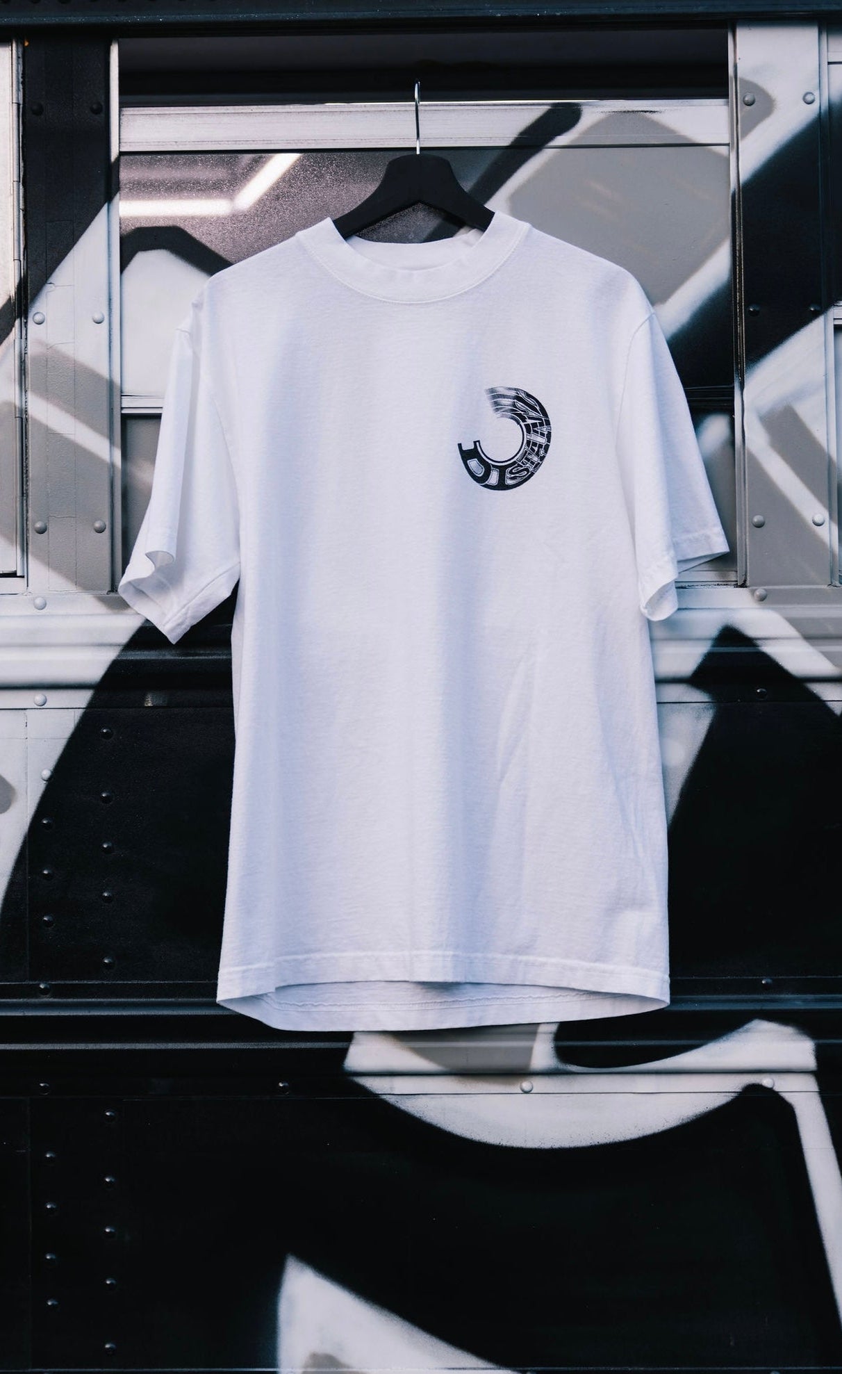 (A) WHEEL SPIN TEE